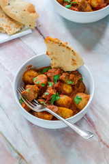 Aloo gosht with naan bread - lamb and potato curry - cuisine popular in Pakistan, Bangladesh and North India