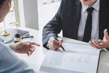 Consultation and conference of Male lawyers and professional businesswoman working and discussion having at law firm in office. Concepts of law, Judge gavel with scales of justice