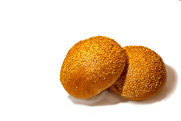 Bun with sesame seeds for a burger on a white background. Isolate