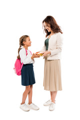 happy mother holding books near daughter with backpack isolated on white