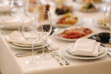 Close up of glasses for vine on the table in the restaurant. Banquet concept