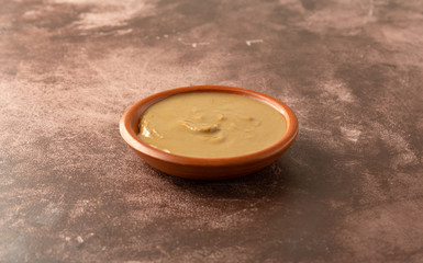 Organic cashew nut butter in a bowl on a table