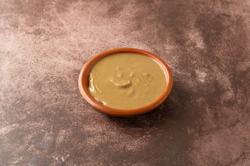 Organic cashew nut butter in a bowl on a table