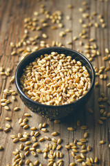 Wheat Grains in bowl and Wheat popcorn in bowl,Wheat Seed rustic background