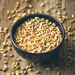 Wheat Grains in bowl and Wheat popcorn in bowl,Wheat Seed rustic background