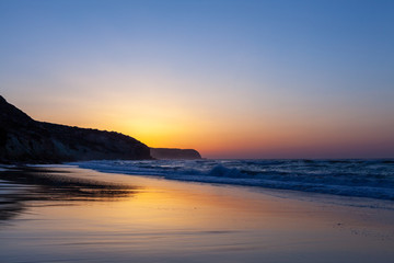 Sunset on beautiful beach at Salema, Portugal