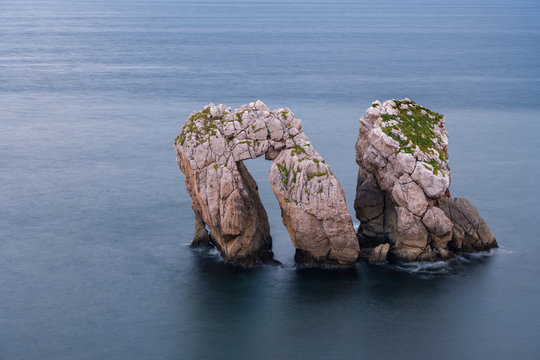 Urros Manzano Bizarre Rock in raging waters and waves at the coast of Cantabria, Northern Spain