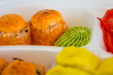 the sushi on the table in the delivery package selectiv focus