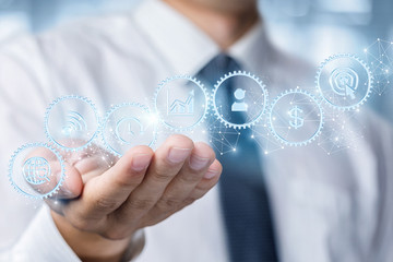 Businessman showing a mechanism for business management.