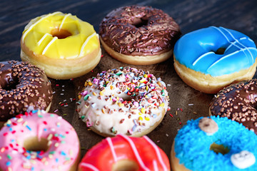 Glazed donuts on wooden background