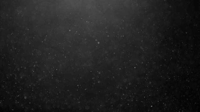Abstract background with animation of flying and flickering particles as bokeh of light. Animation of seamless loop.Dust bubbles snow animation.