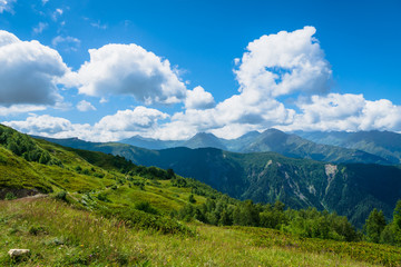 Fototapeta na wymiar Svaneti landscape with mountains on the trekking and hiking route near Mestia village in Svaneti region, Georgia.