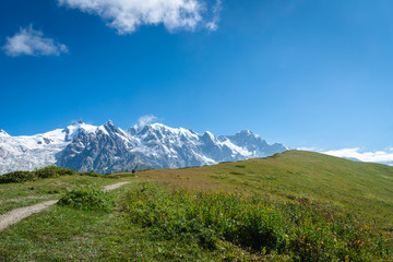 Fototapeta premium Svaneti landscape with glacier and snow-capped mountain in the back near Mestia village in Svaneti region, Georgia.
