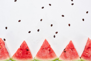 row of delicious juicy watermelon slices on white background