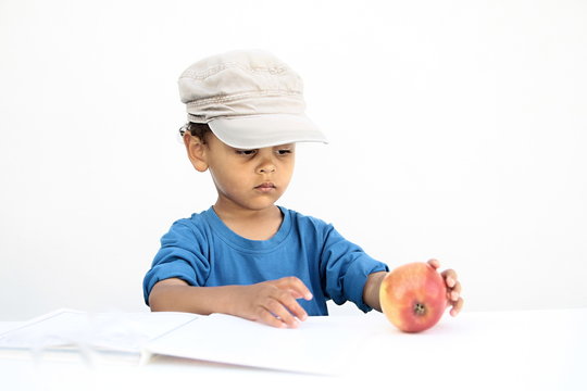 little boy with apple on white background eating healthy stock image stock photo