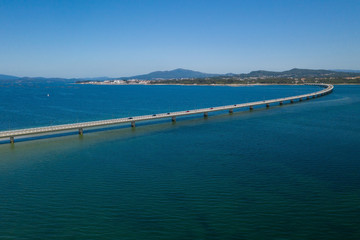 Fototapeta na wymiar bridge over the sea bay view from above