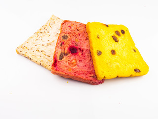 Whole wheat bread mixed with pumpkin and beetroot and black sesame seeds, isolated on a white background.