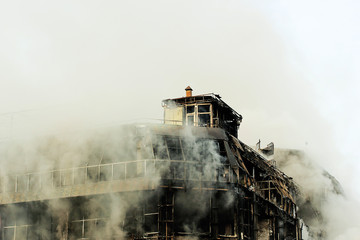 Fototapeta premium shopping center or mall fire,smoke,fighters,space for copy or text,toned photo