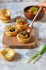 mini empty tarts on cutting board on bright background,making process