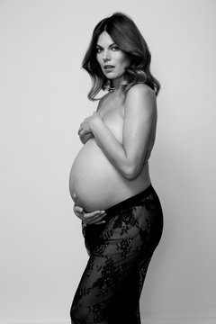 Amazing pregnant woman feeling beautiful