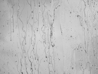 The raindrops and drips on a glass