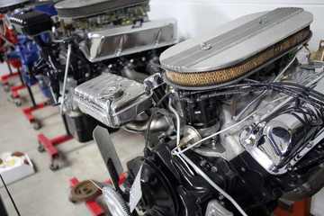 Fototapeta na wymiar Row of American V8 engines in an automotive shop.