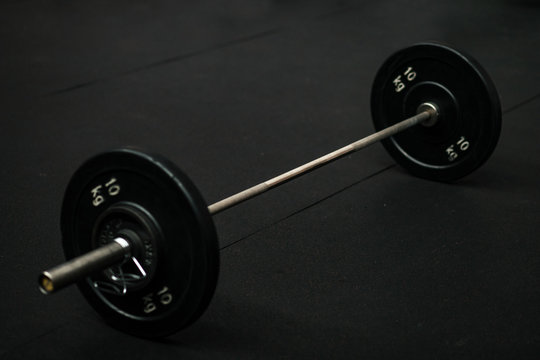 Black metal dumbbell in the gym