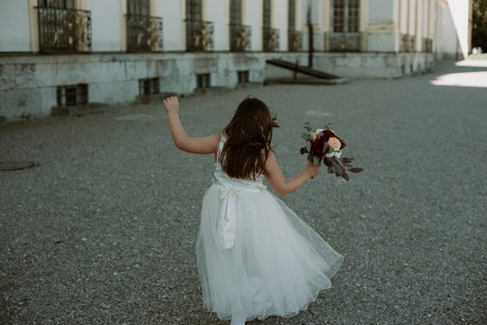 Girl running with a bouquet