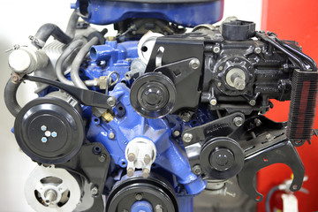 An American V8 combustion engine on display at an automotive shop.