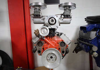 An American V8 combustion engine on display at an automotive shop.