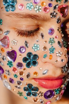 Closeup beauty portrait of face covered with crystals