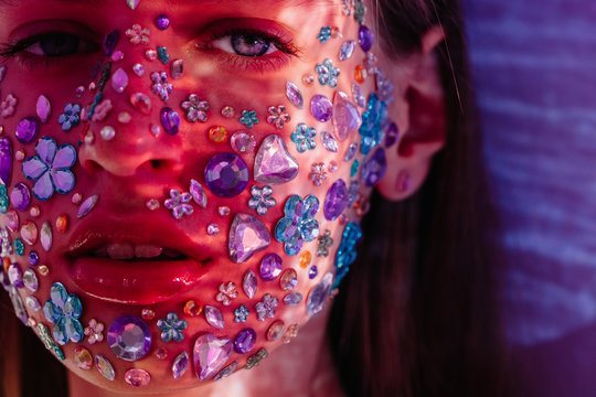 Closeup beauty portrait of face covered with crystals
