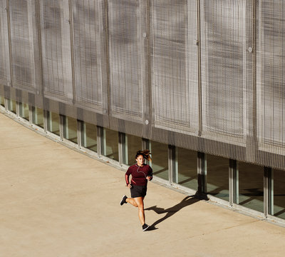 Athlete running in urban outdoors to maintain a healthy lifestyle