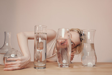 Sensual woman with glassware full of water