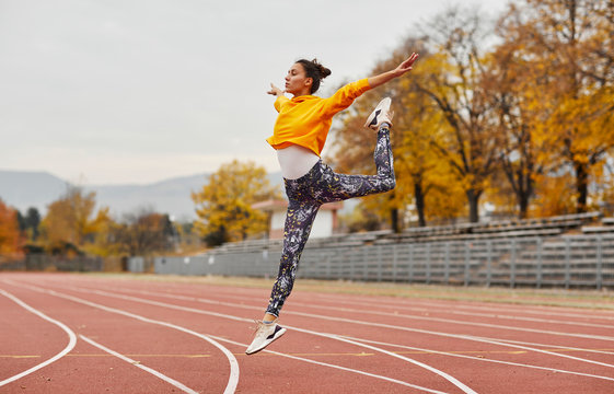 Woman training at a running track