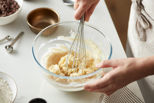 Cook preparing dough for cookies.