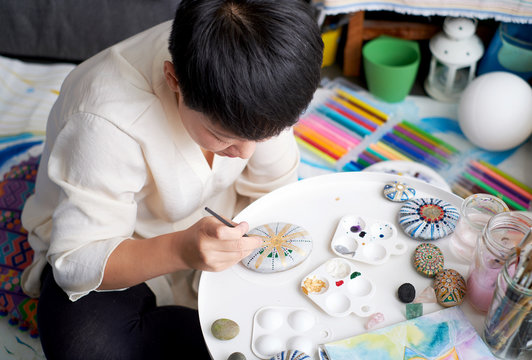 Asian woman painter, art painter. Work at home