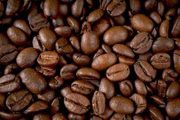 dark background with fragrant brown coffee seeds