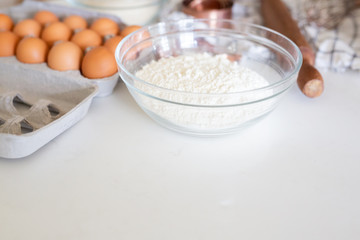 Baking Ingredients with Brown Eggs in Carton
