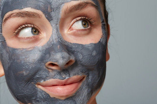 woman doing clay mask treatment