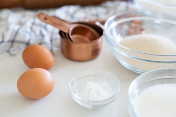 Cake ingredients, eggs, sugar, and  baking soda