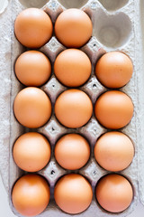 brown eggs in cardboard carton