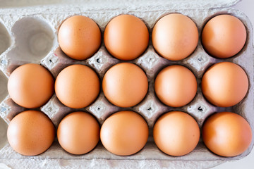brown eggs in cardboard carton