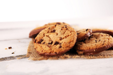 Chocolate cookies on wooden table. Chocolate chip cookies shot on wooden white table