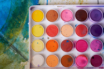 Close-up of a paint box on a canvas