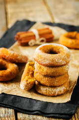 Baked pumpkin donuts with glasses of milk