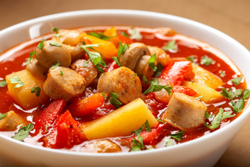 Stew or soup made from vegetables and german sausages