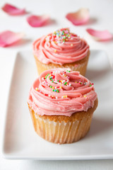 Pink cupcakes with rose petals 