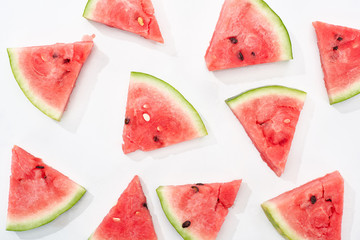 top view of organic juicy watermelon slices on white background