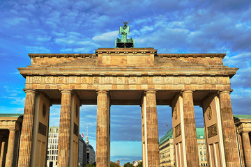 Fototapeta premium quadriga with the goddess of victory Victoria at the top of the monumental Brandenburg Gate in Berlin.